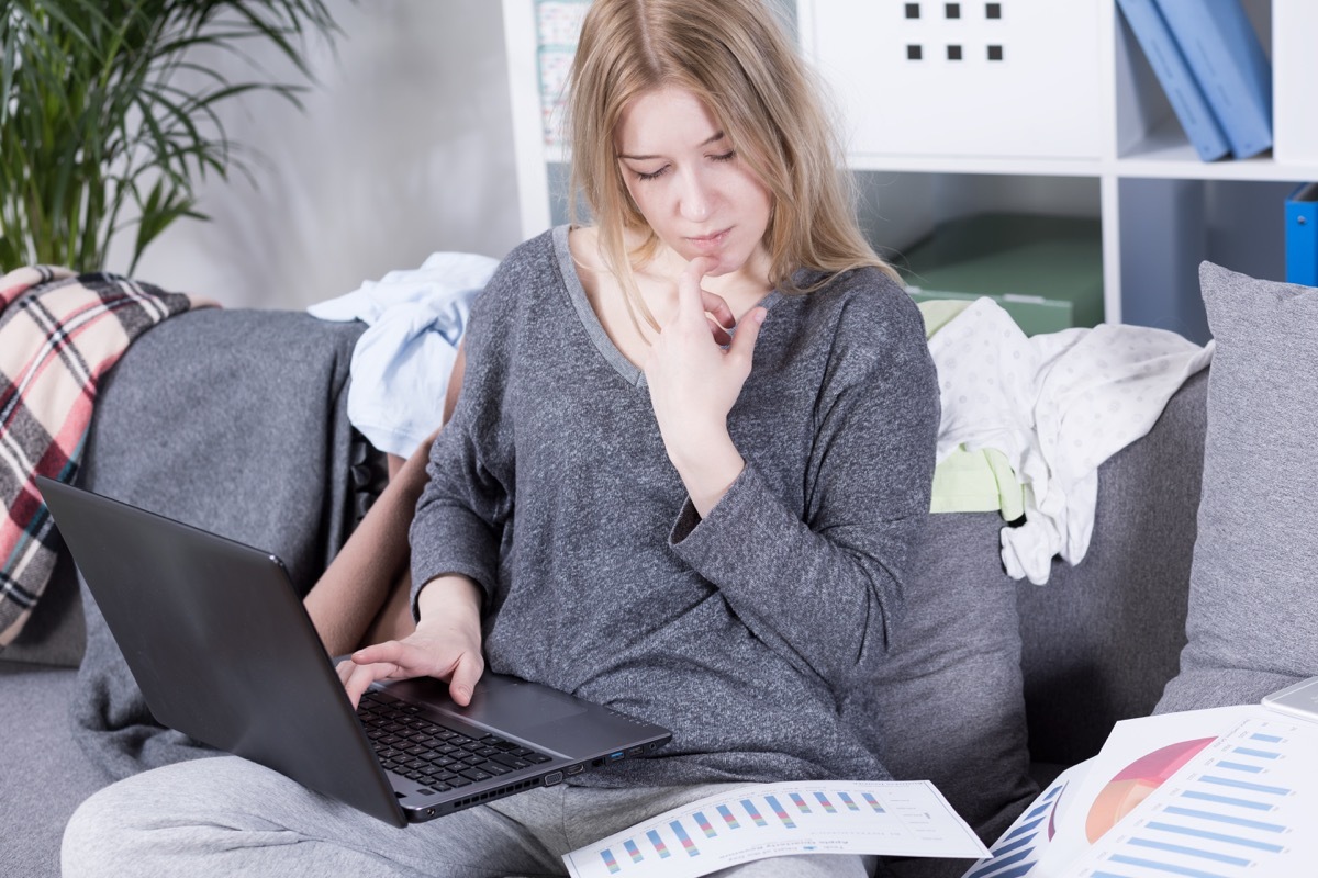 young blonde woman wearing sweats on the couch