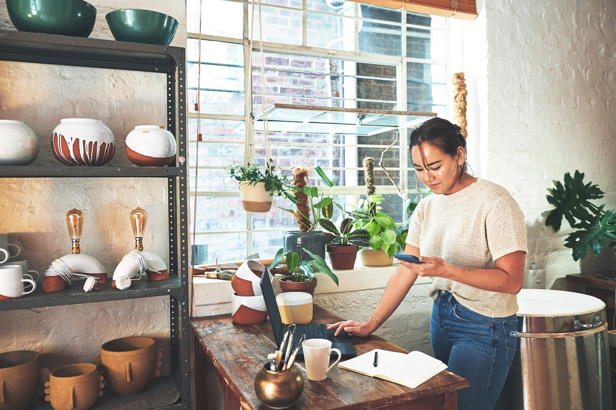 art studio with young woman at the register 