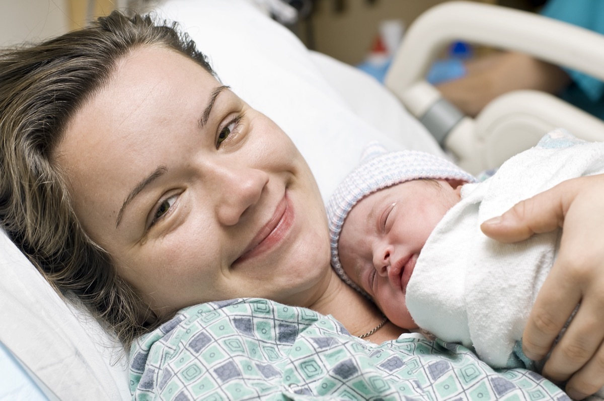 Happy mother with newborn baby