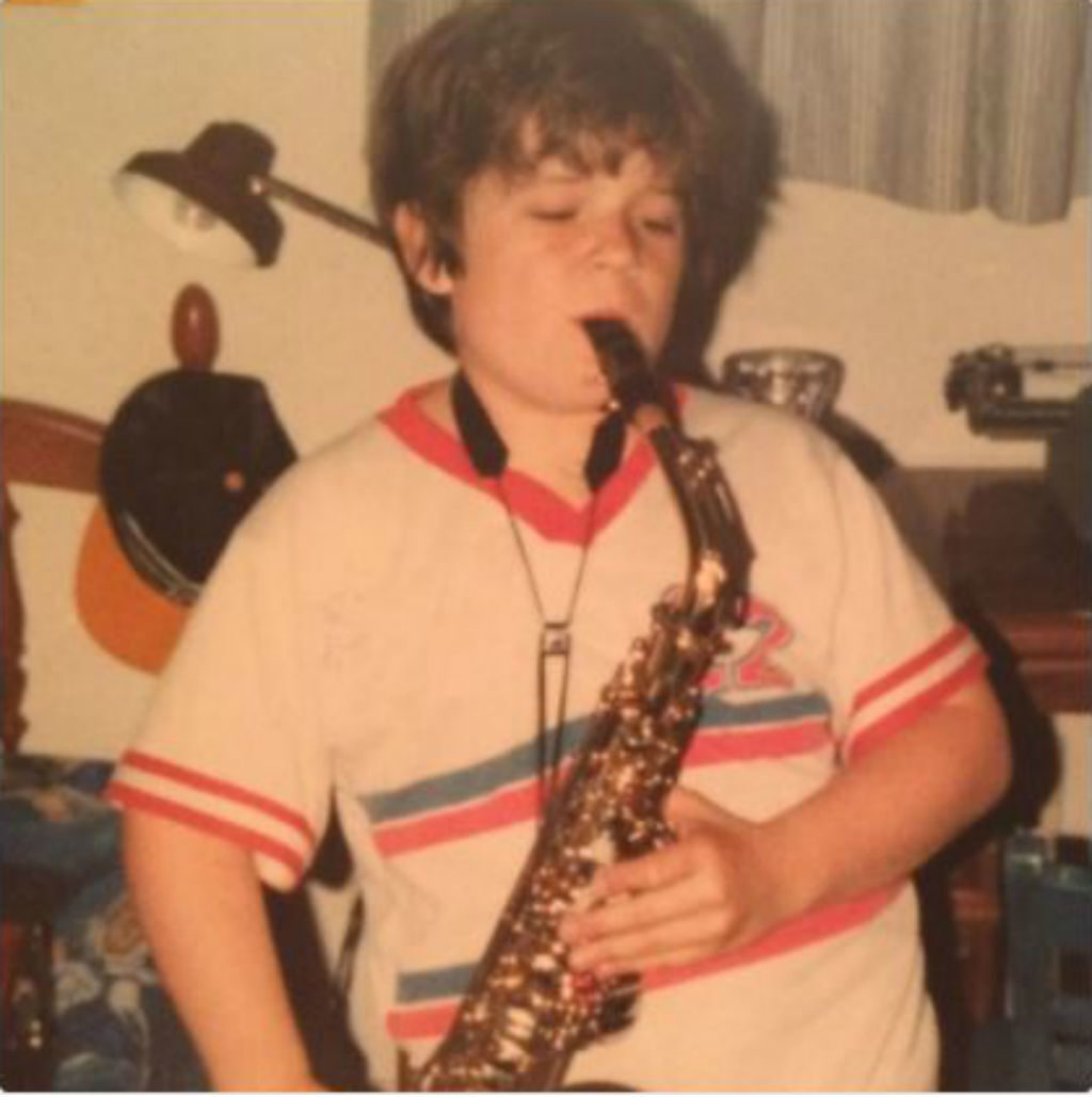 Teen Patton Oswalt playing a saxophone