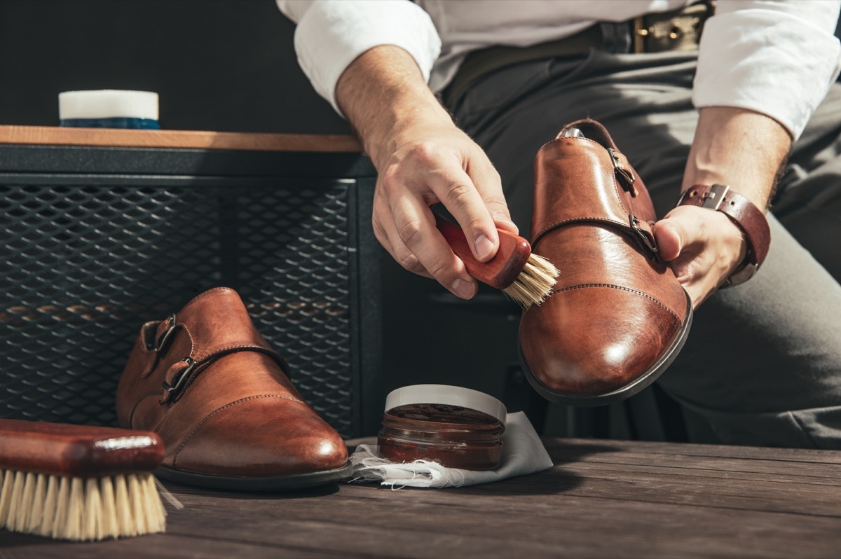 man shining light brown double monk strap shoes