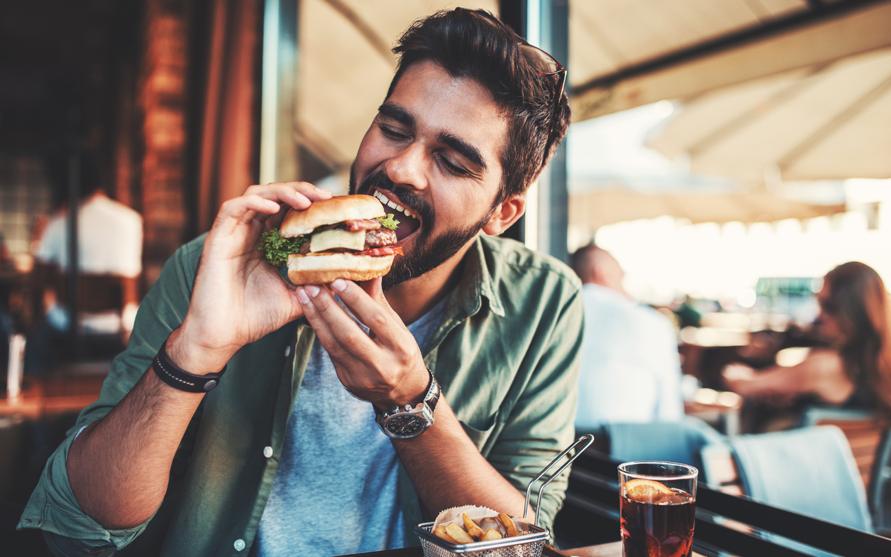 young man eating a sandwich