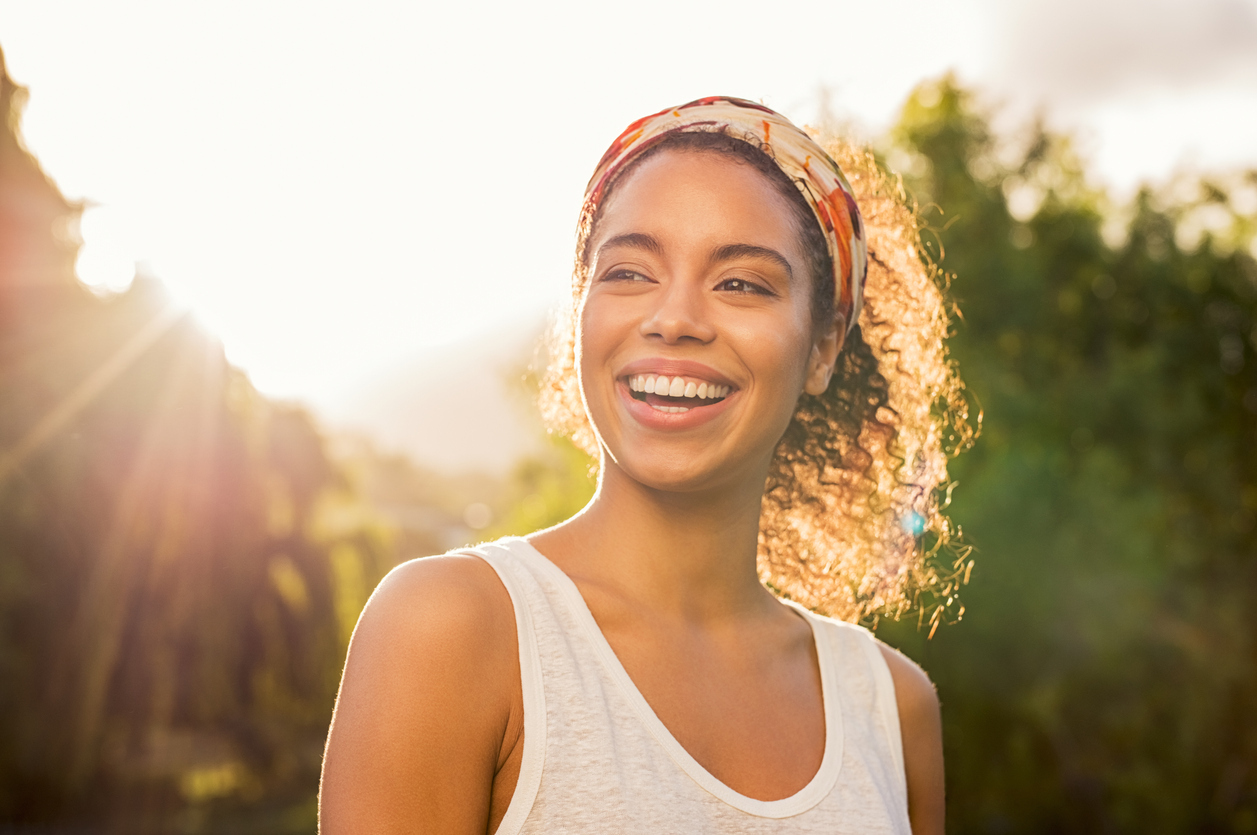 beautiful black woman smiling outside