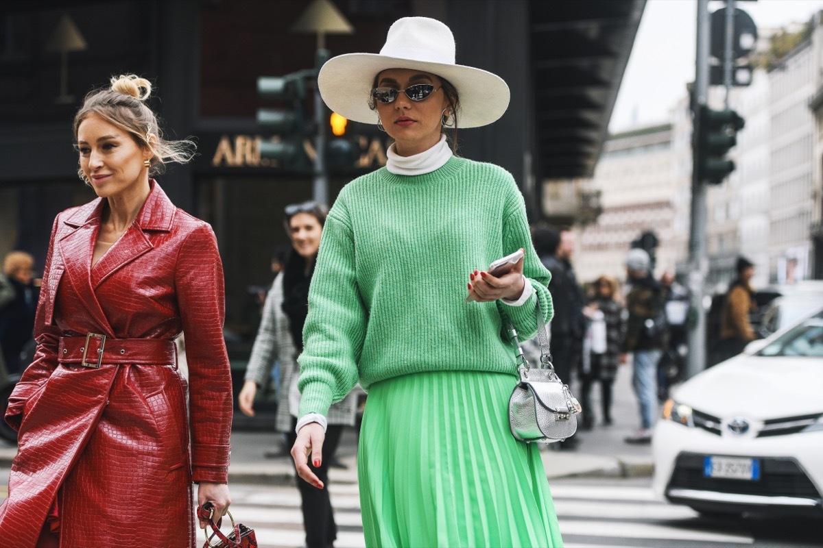 Woman wearing green turtleneck in Italy. 