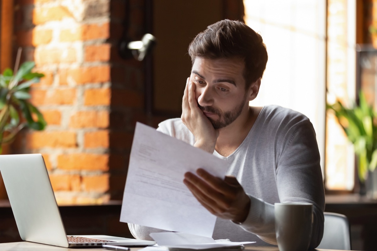 Man looking at debt