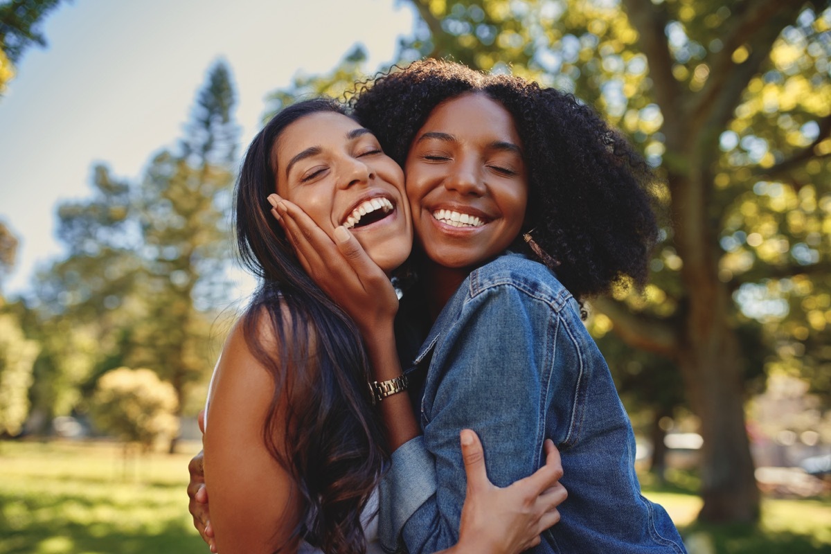 Two Friends Embracing and Hugging