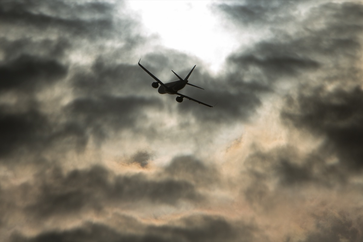 plane flying into storm