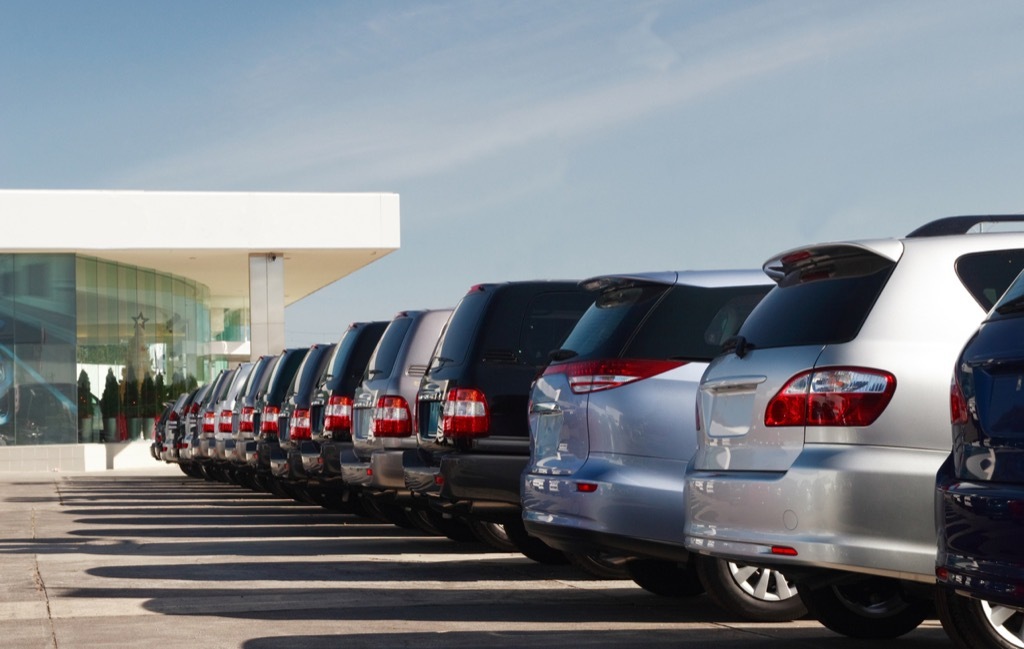 rows of suvs at car dealership