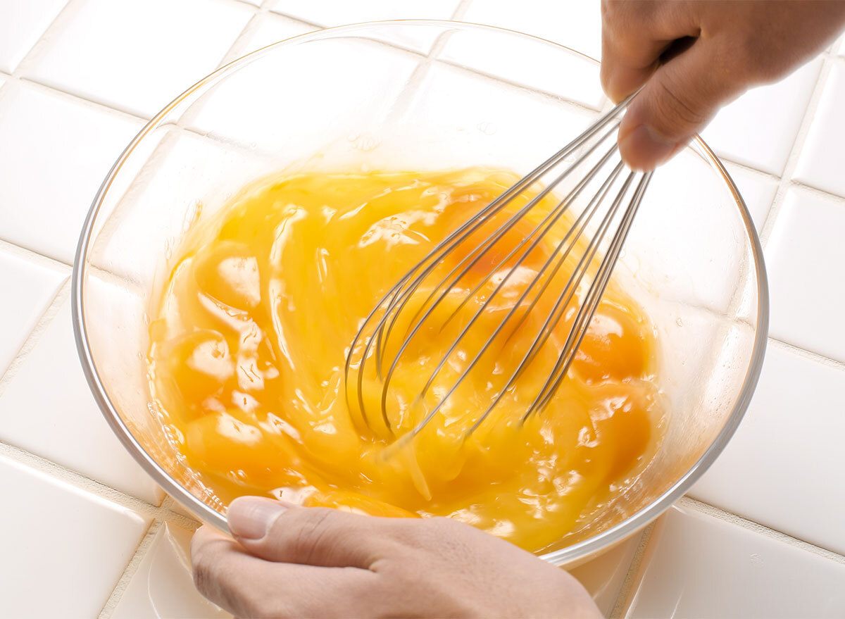 whisking eggs in bowl