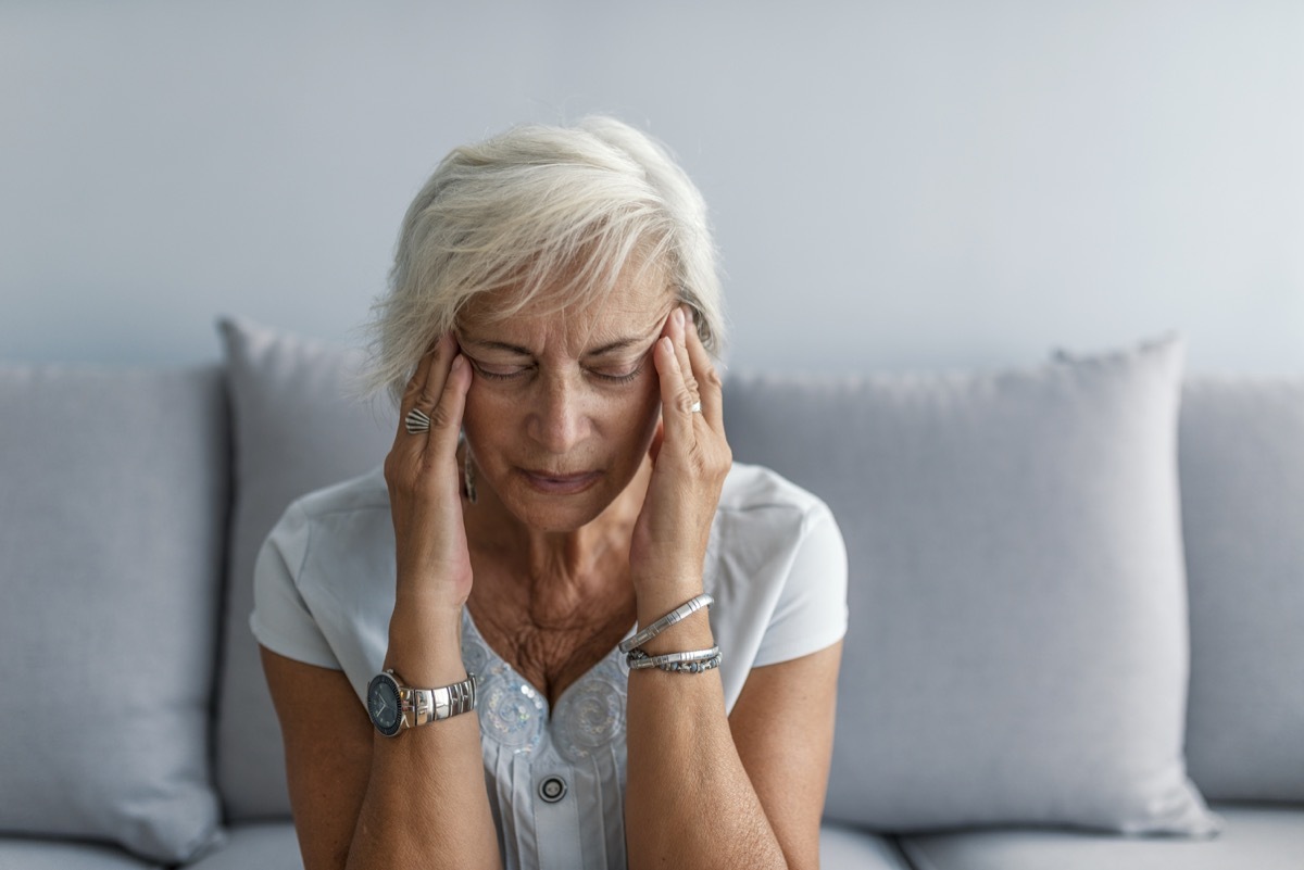 Woman having headache migraine