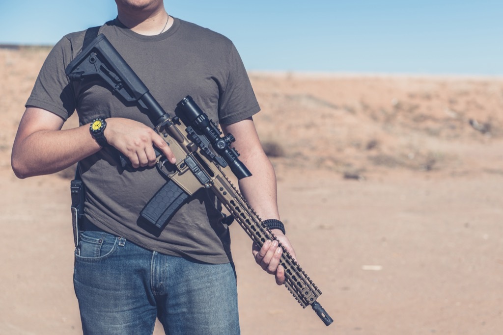 Man posing with gun