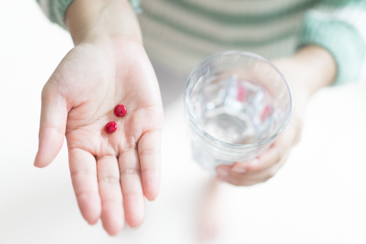 Two Iron Tablets and a Glass of Water