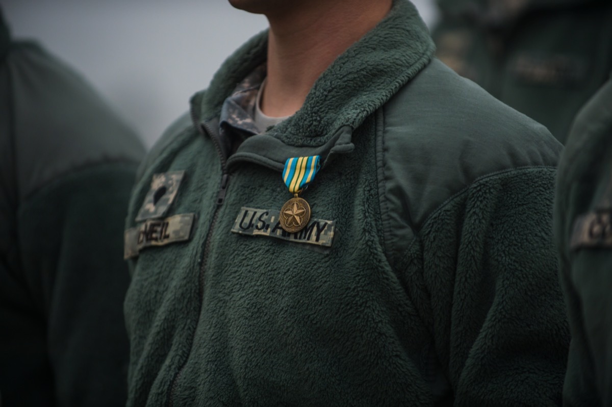 the chest of a military man wearing a green 