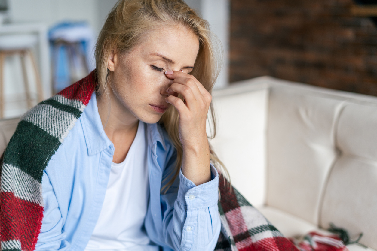 Fatigued woman sitting down. 