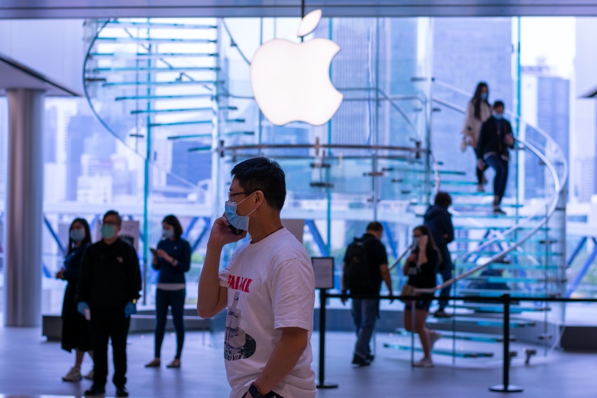 shoppers wearing face masks in apple store