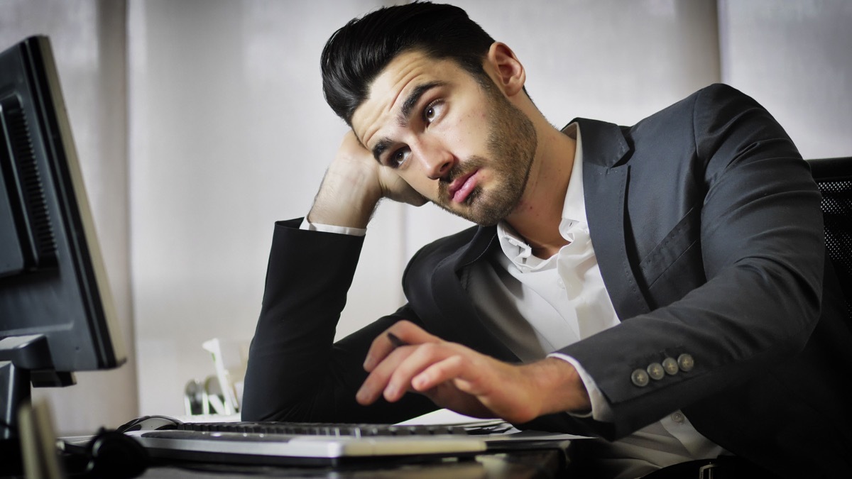 Bored guy slacking at work