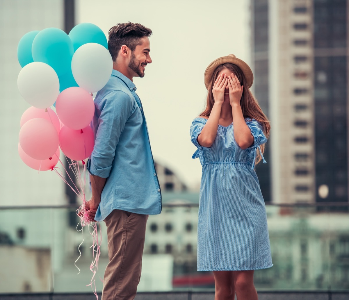 Man Surprising Girlfriend with Balloons