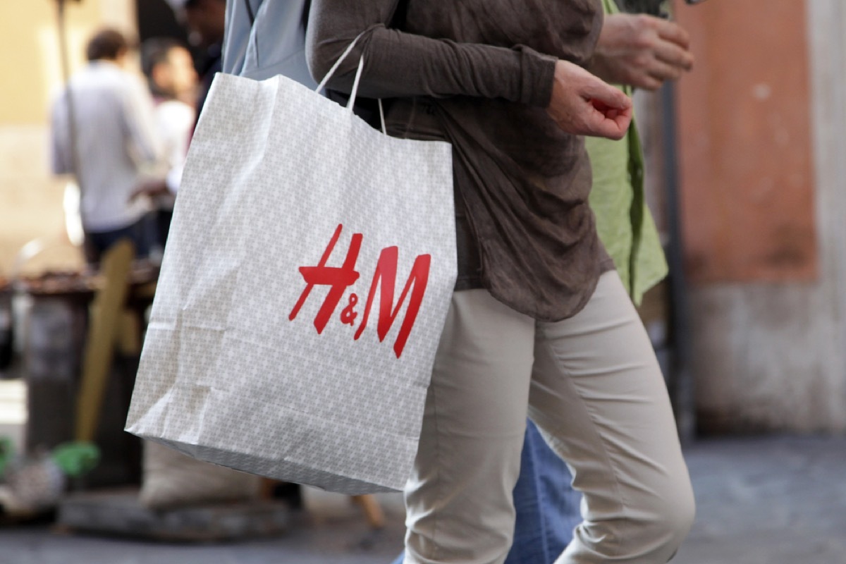 close up of h&m bag being carried by a man