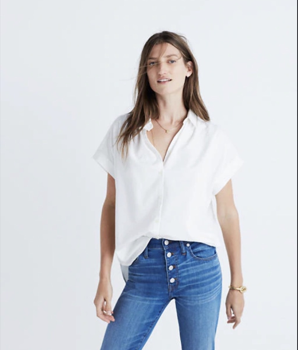 woman in white top and jeans