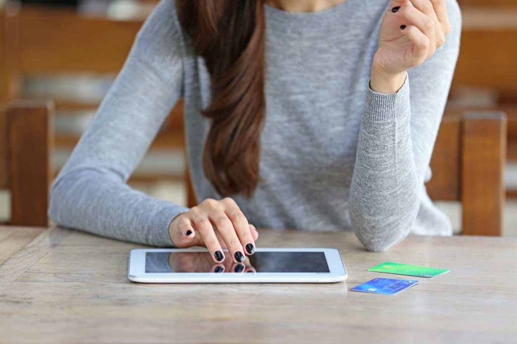 Woman alone on her iPad, suffering through a breakup