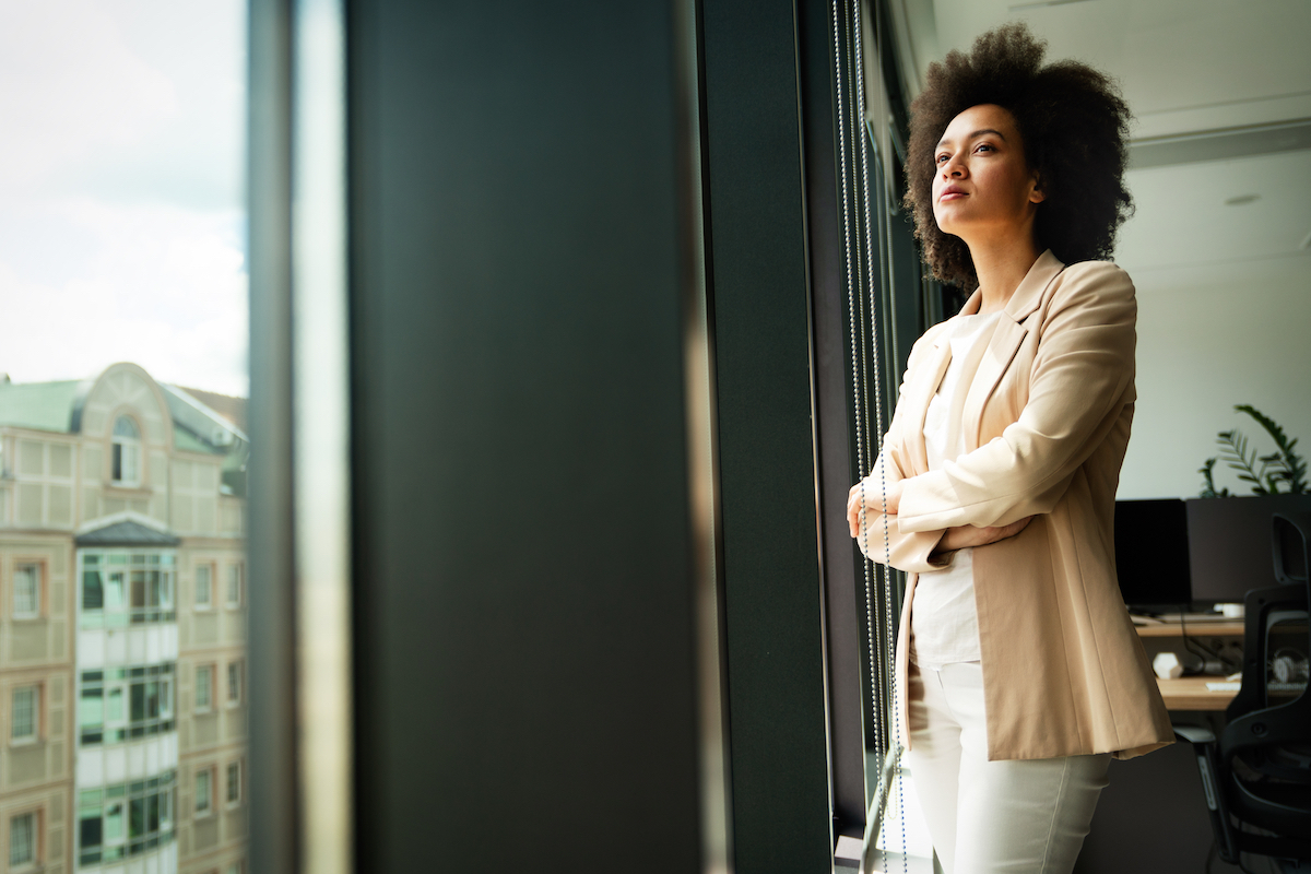 woman standing near window