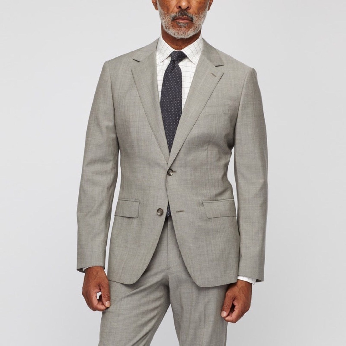 middle aged black man in gray suit