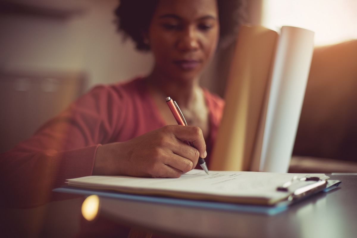 woman signing papers, teacher parent lies