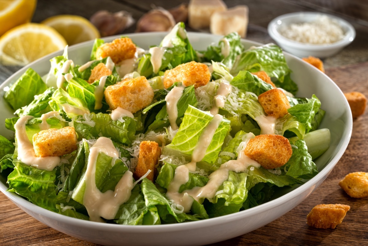 caesar salad in white bowl