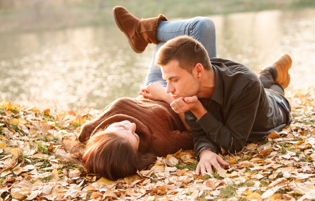 young couple sitting in the leaves, open marriage