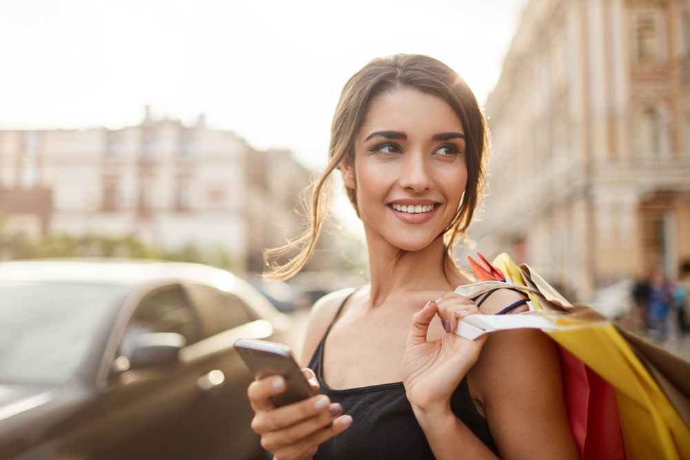 woman with multiple shopping bags