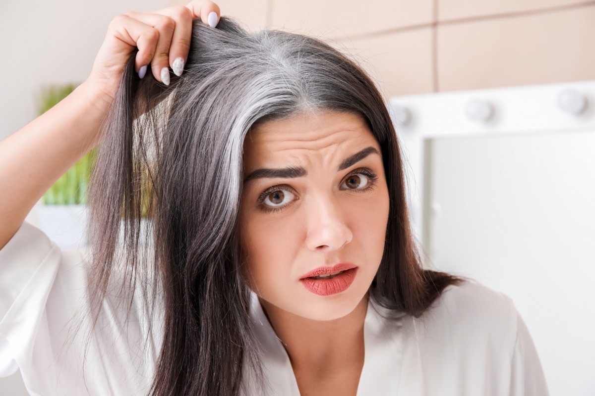 Woman Looking at gray Hair