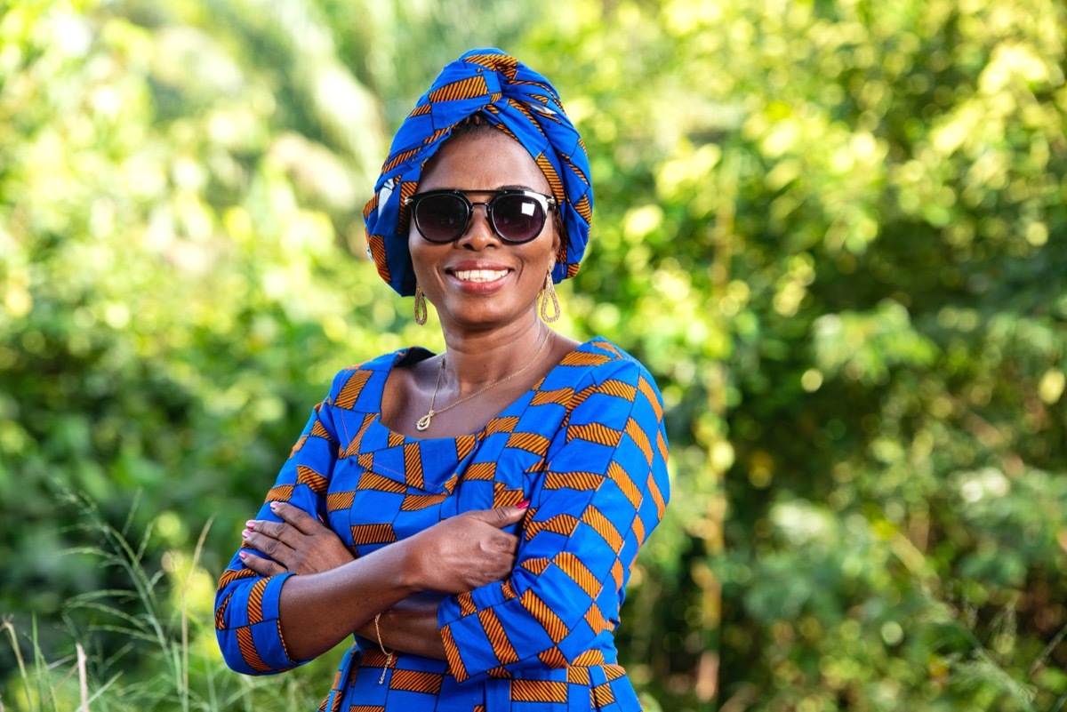 Woman smiling wearing sunglasses