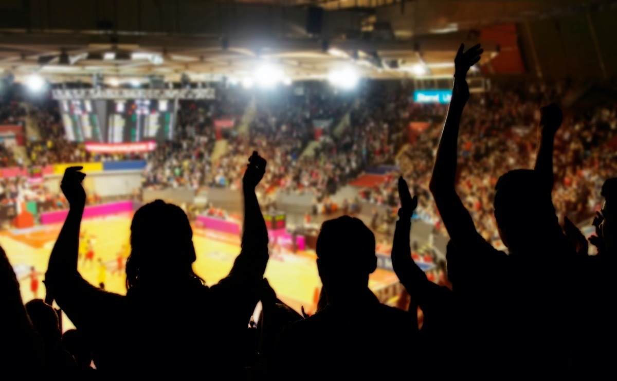 crowd cheering at basketball stadium