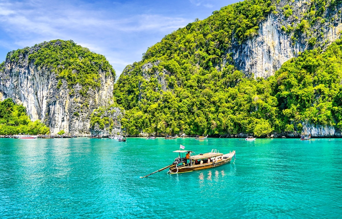 a boat by the island of phuket thailand