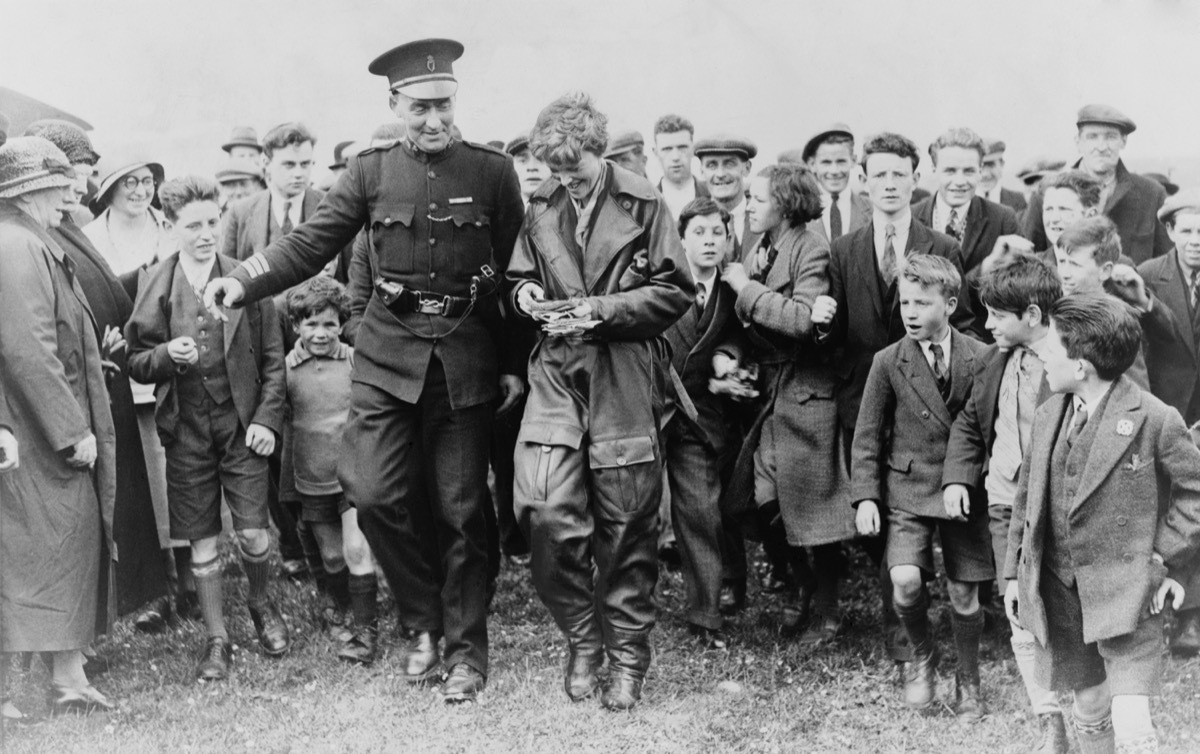 amelia earhart with crowd of admirers in london conspiracy theories about amelia earhart