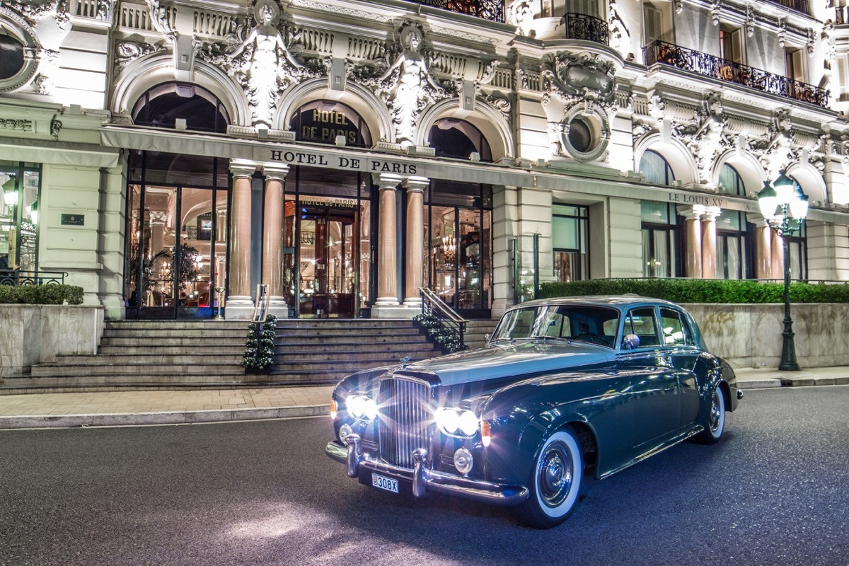 Old fashioned car parked outside Hotel de Paris in Monte Carlo