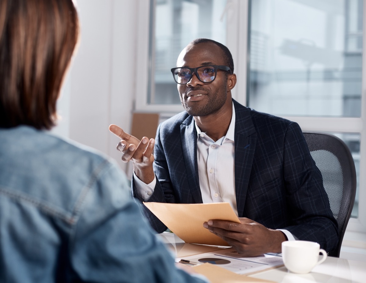 man making suggestion will talking to colleague