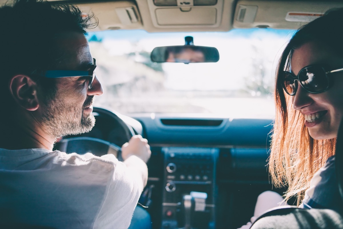 Adults driving in car