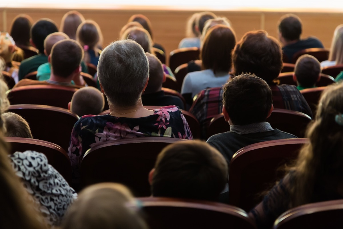 Parents in a meeting in an auditorium how to make friends as an adult