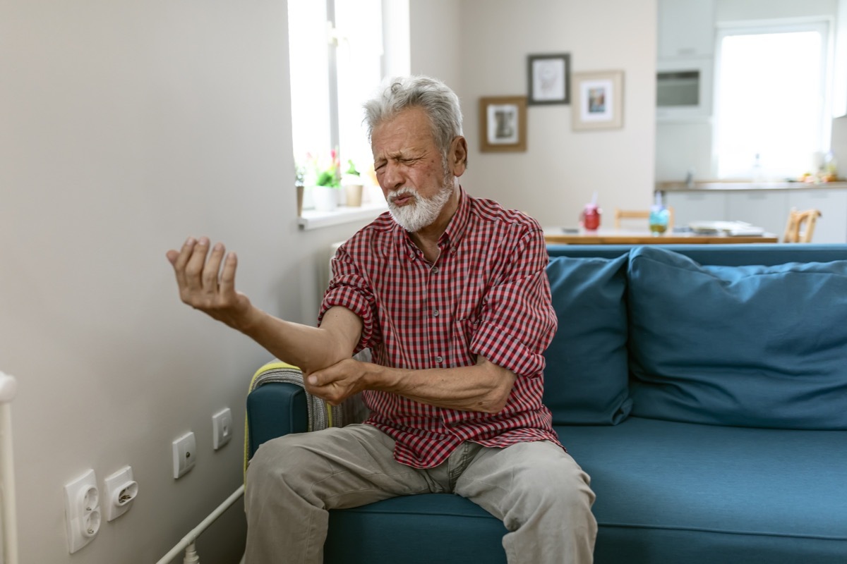 Man with bone ache in elbow arm