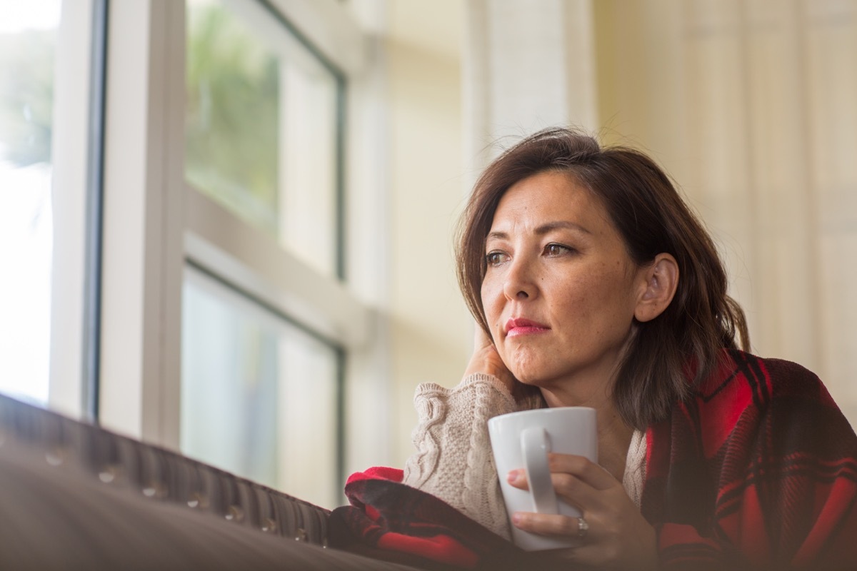 sad woman looking out to the side