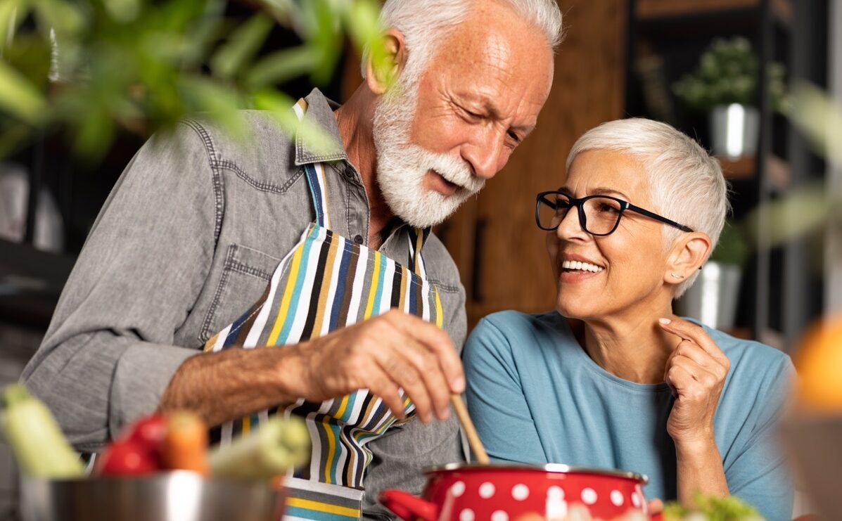 Older couple cooking together