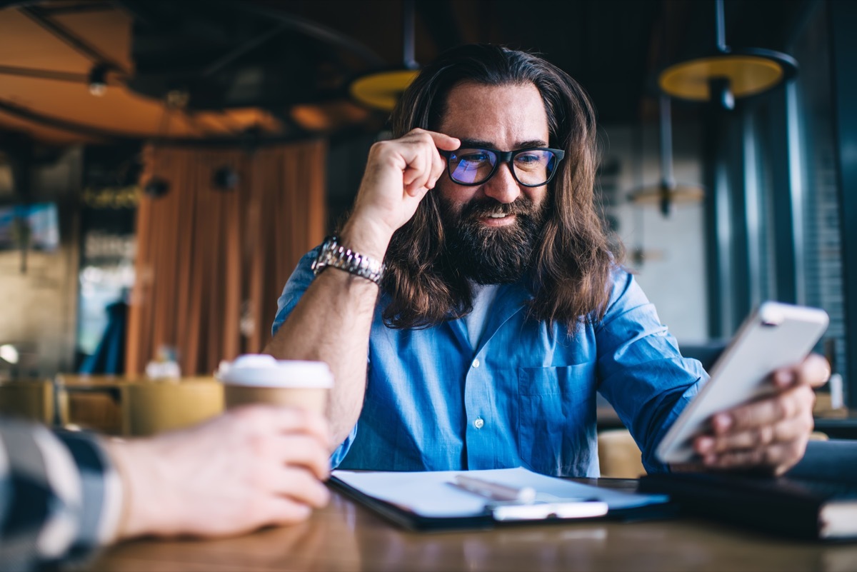 man receiving a good morning message on his phone