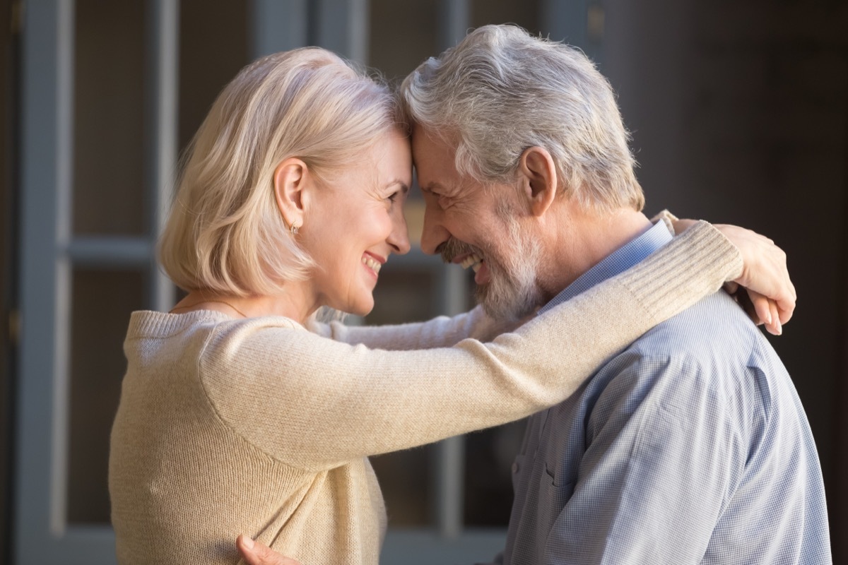 older couple embracing and looking into each other's eyes