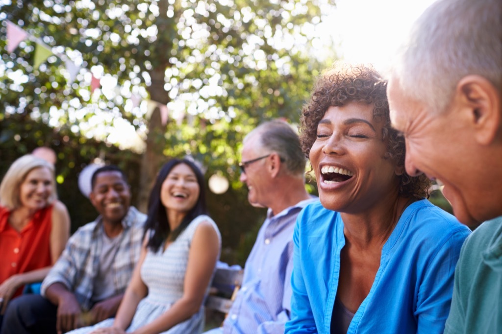 middle aged friends chatting and laughing