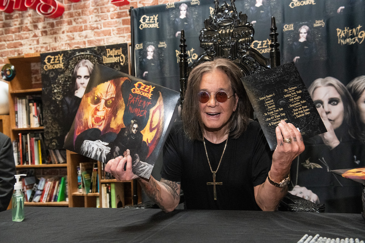 Ozzy Osbourne signing copies of 