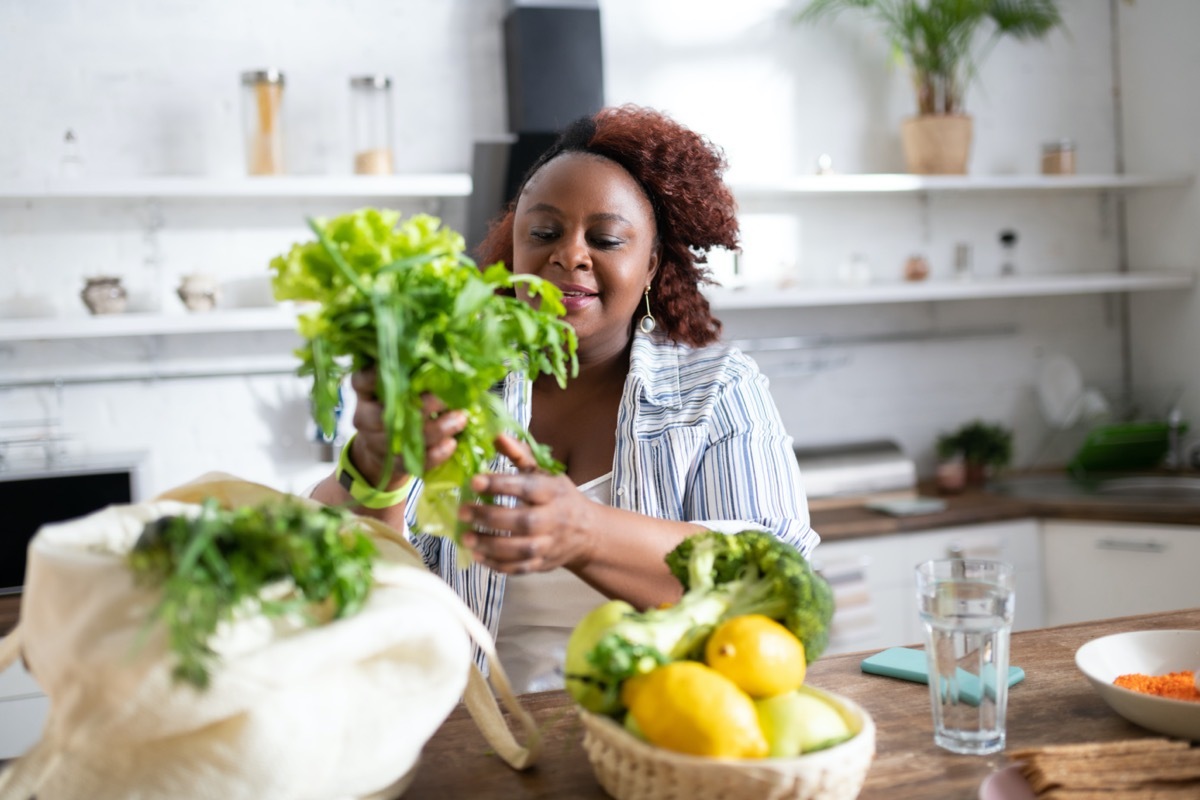 middle age woman spending time alone in kitchen