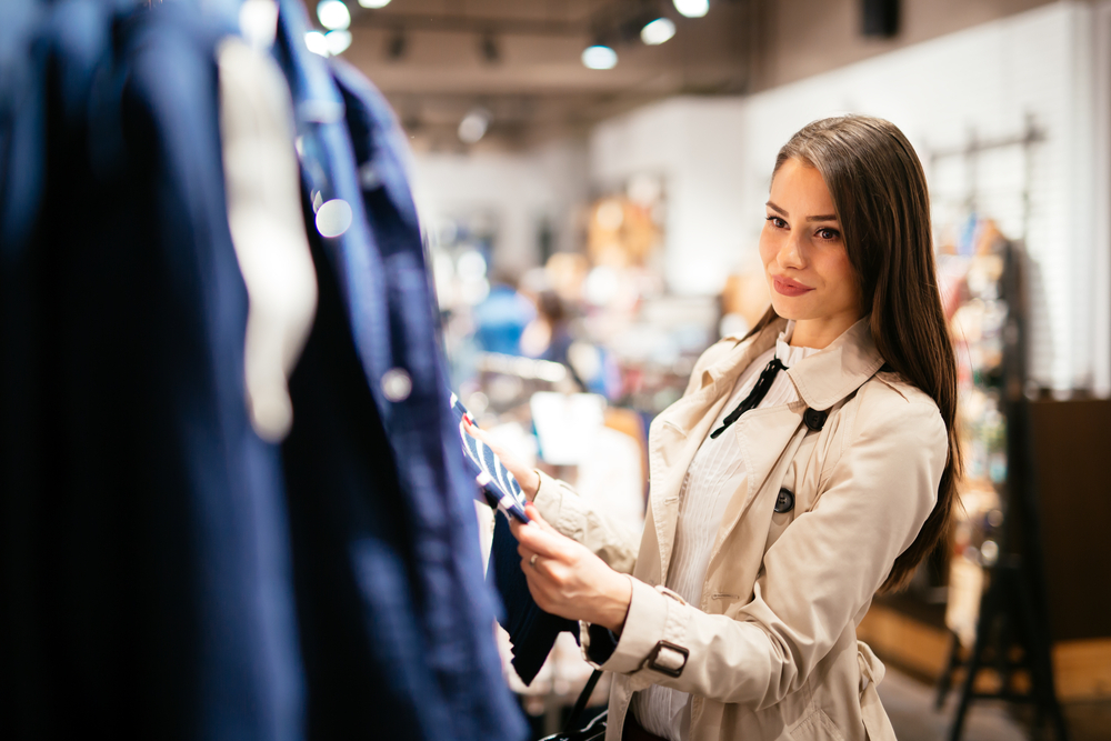 Woman in trench coat shopping