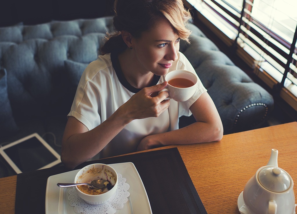 Woman sipping tea