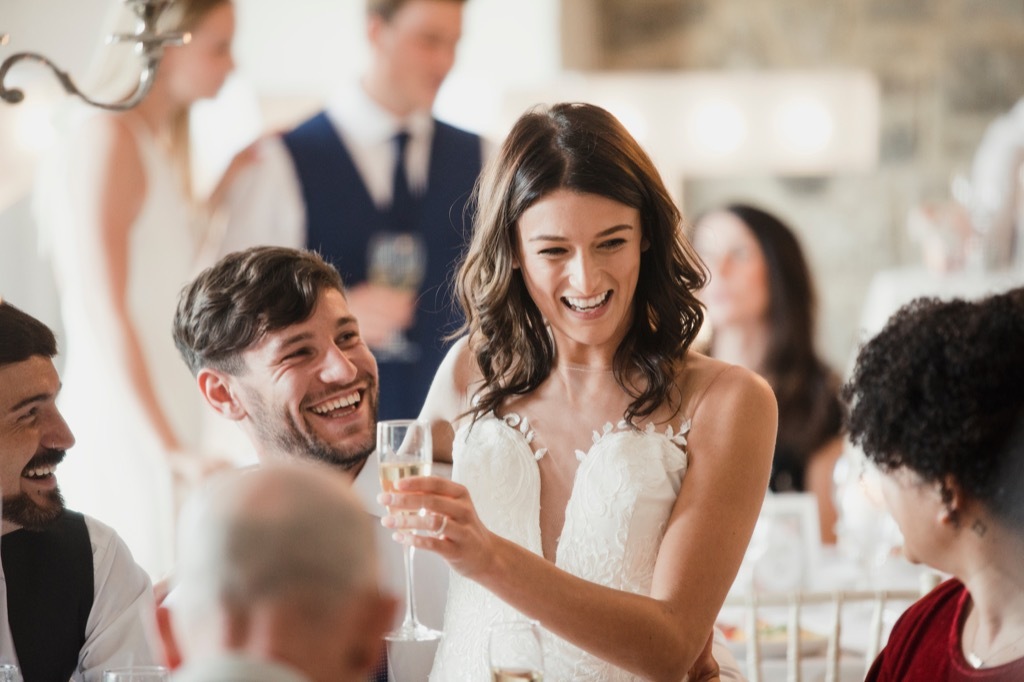 bride and groom hanging out with friends Never do at a Wedding